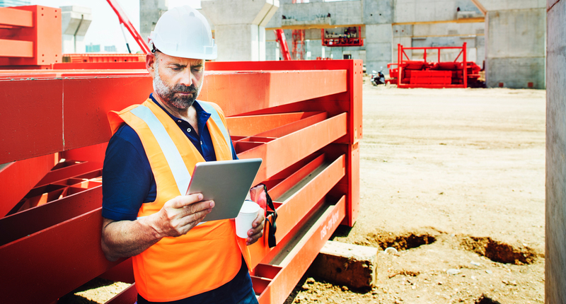 A crew supervisor managing workforce on a tablet device