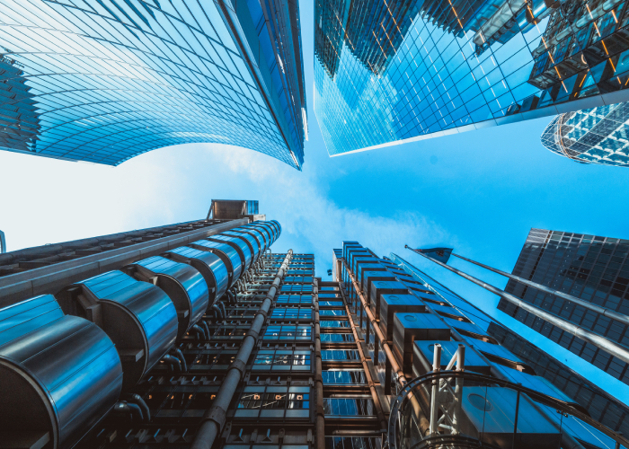 Upward view of modern skyscrapers representing growth and innovation in professional services