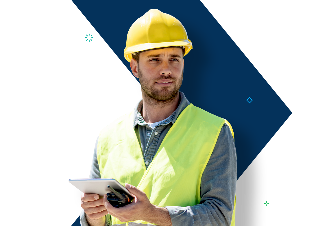 Construction worker using a tablet on-site, supported by Deltek Construction Software.