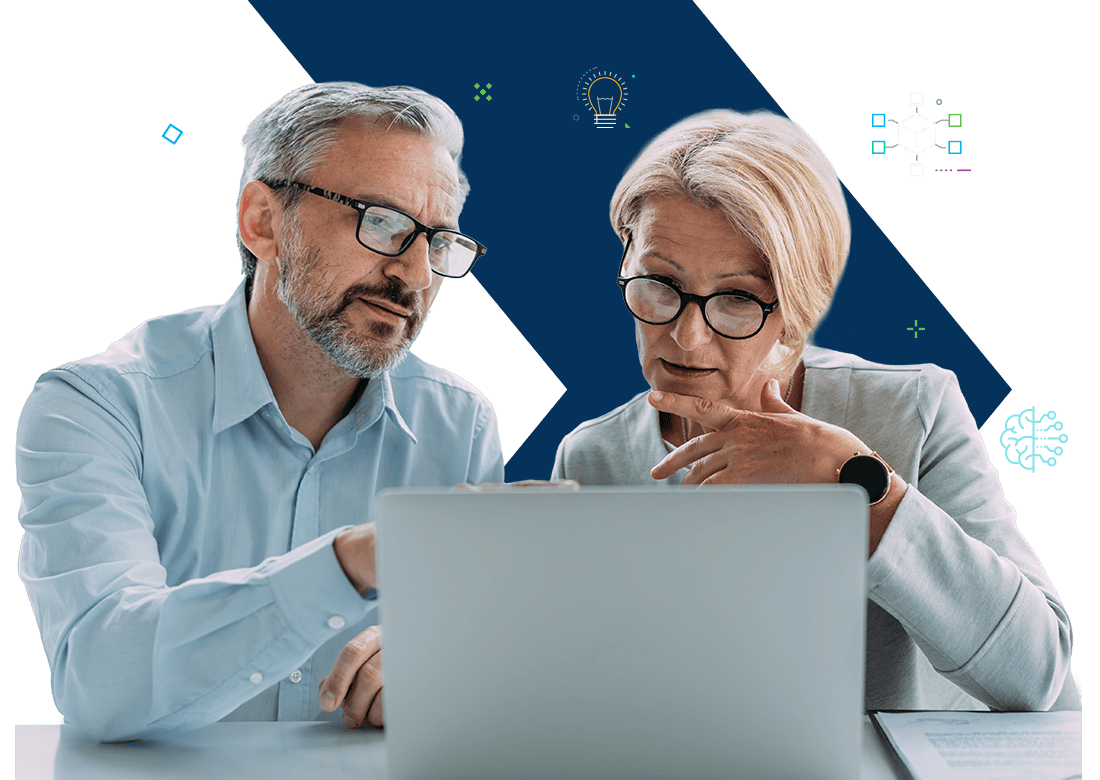 Two professionals collaborating on a laptop to configure Deltek integrations for business systems.