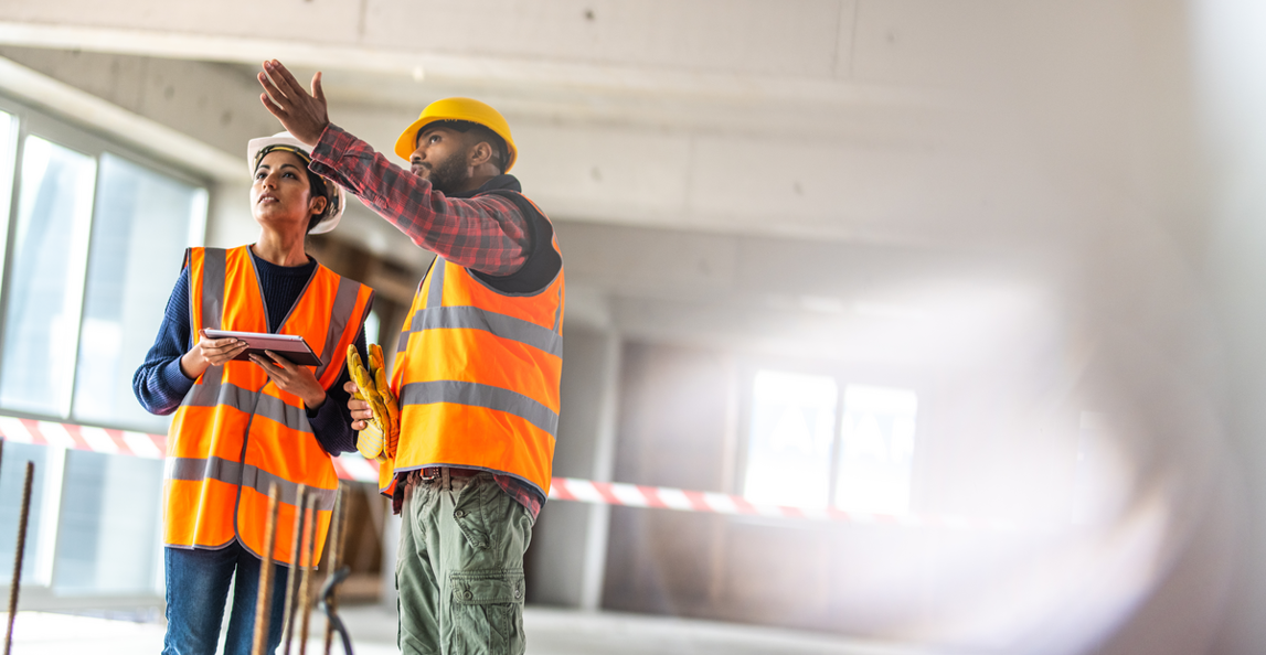 architect and construction worker on punch list walkthrough