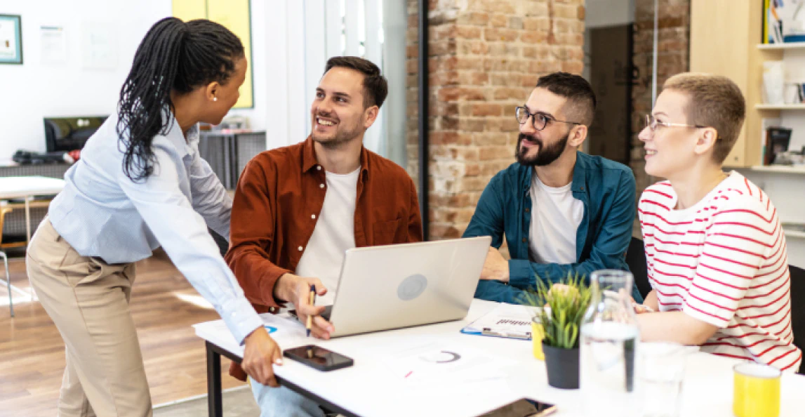 Cheerful Team of Coworkers Making Great Business Discussion in Modern Office