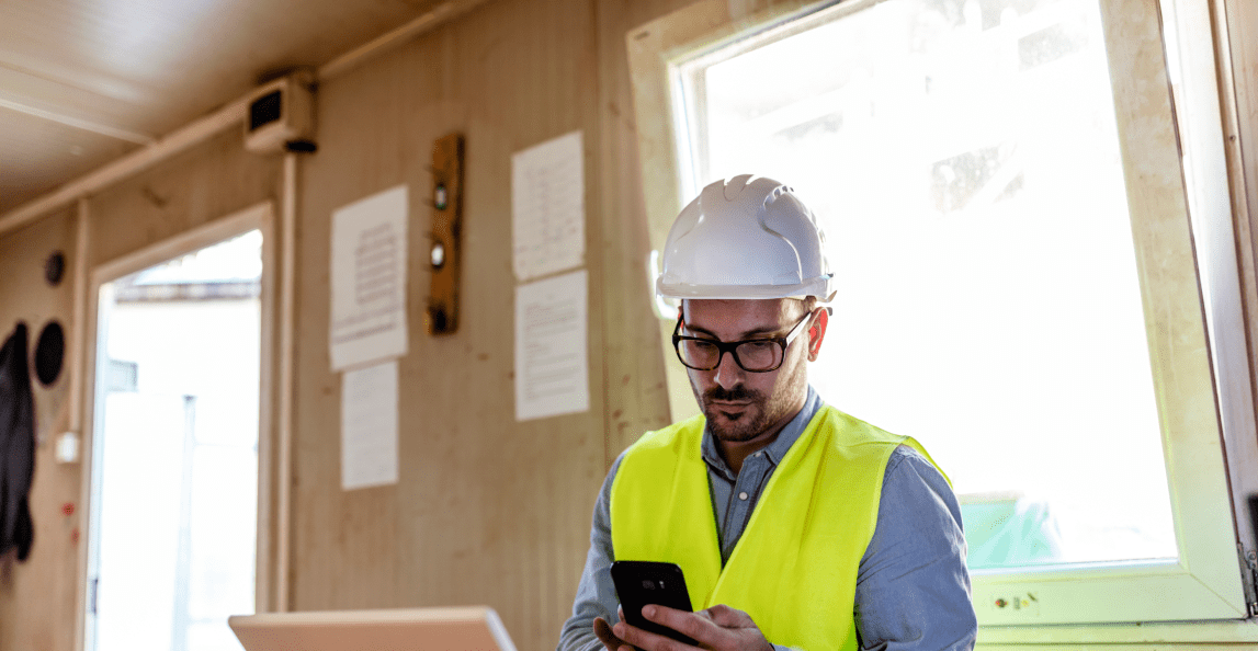 Construction project manager reviewing site updates