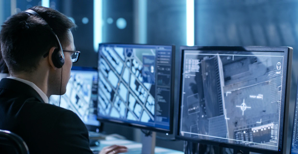 Cybersecurity analyst monitoring security systems and threat detection dashboards