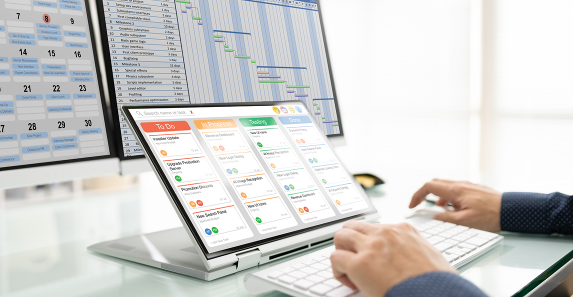 Professional showing schedules and task boards on monitors