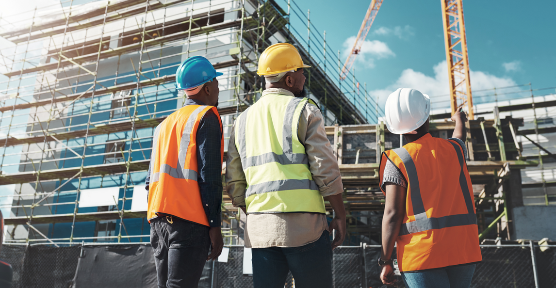 project management team assessing a commercial building under construction