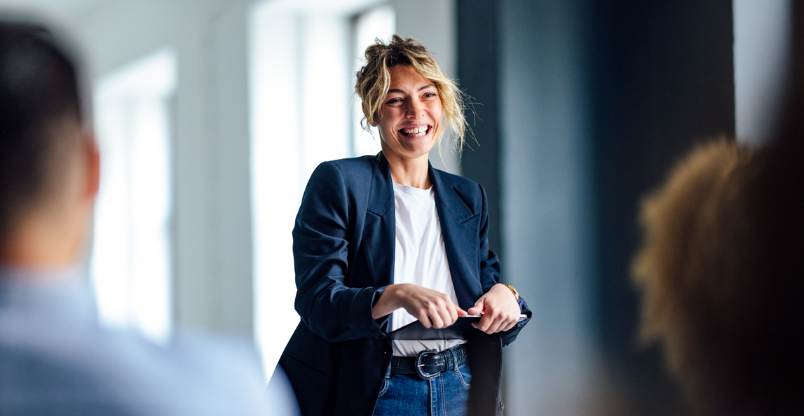 female business leader presenting to her team