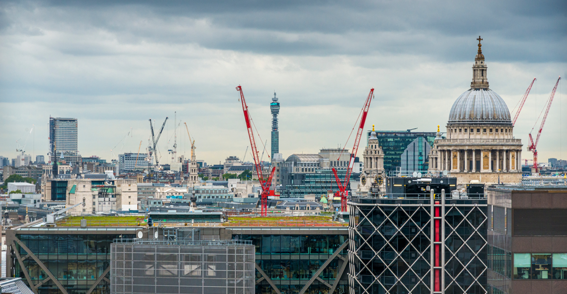 Aerial view of London city with multiple construction cranes