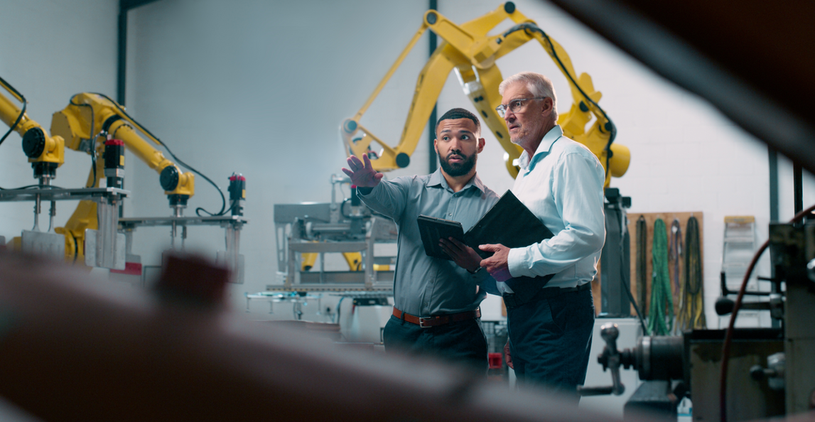 engineers discussing project on the factory floor