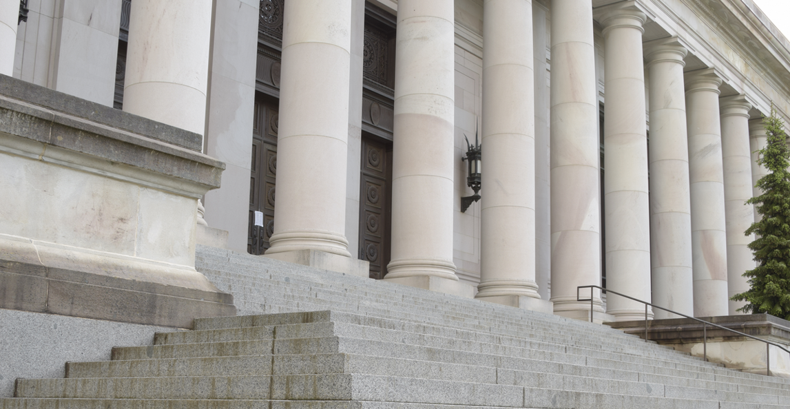 Sandstone steps and columns of a federal government building in Washington D.C.