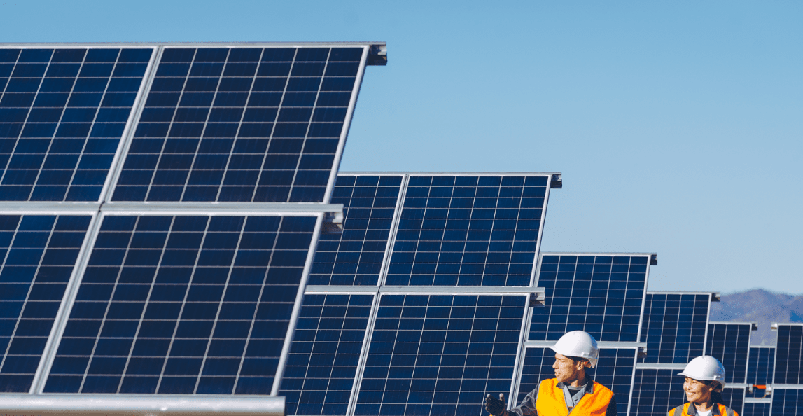 workers at a solar power station