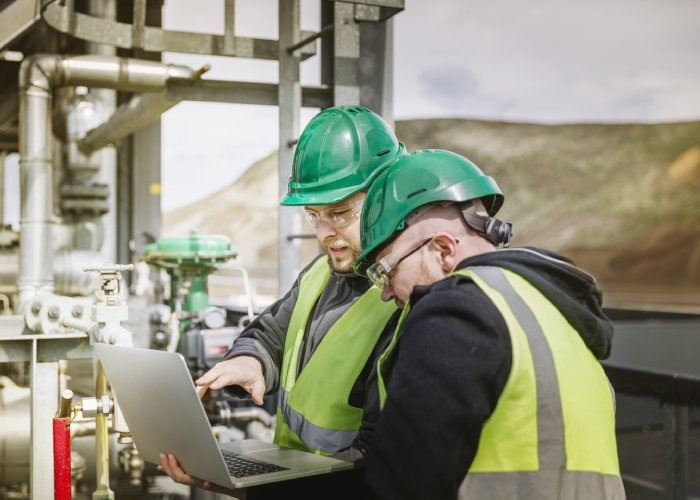 Two Engineer discussing with laptop