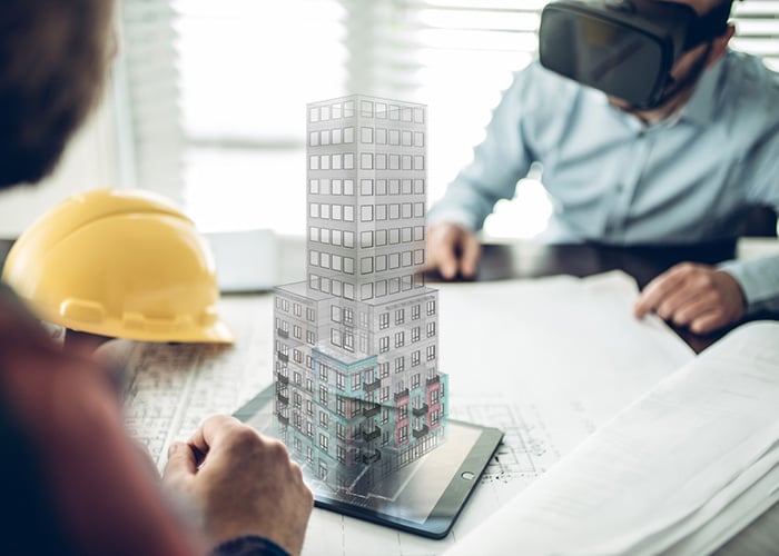 3D building model visualization on tablet with construction plans