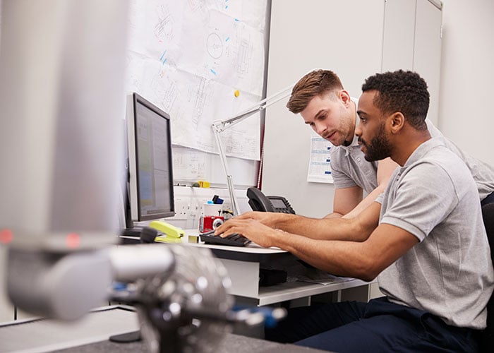 Small business coworkers collaborating on a computer