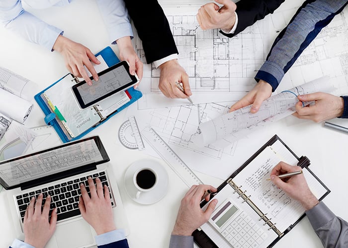 Business professionals discussing a development project.