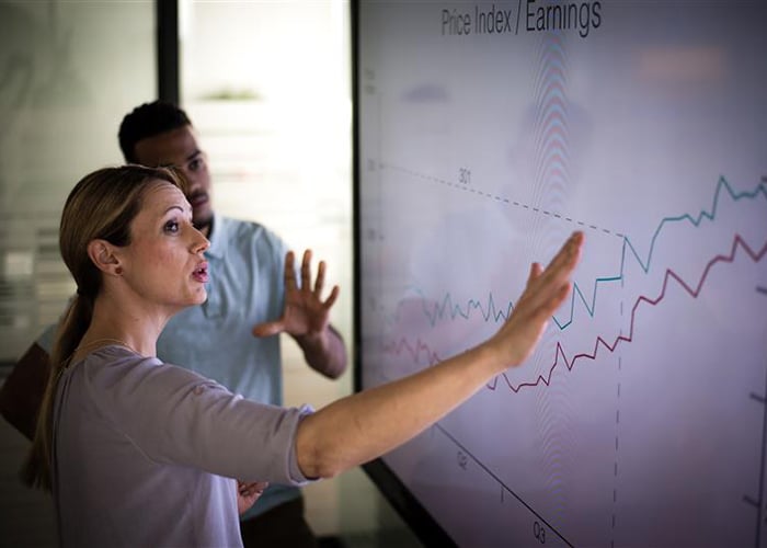 two workers doing a business presentation