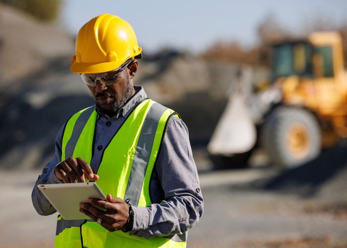 Construction Worker Using a Tablet