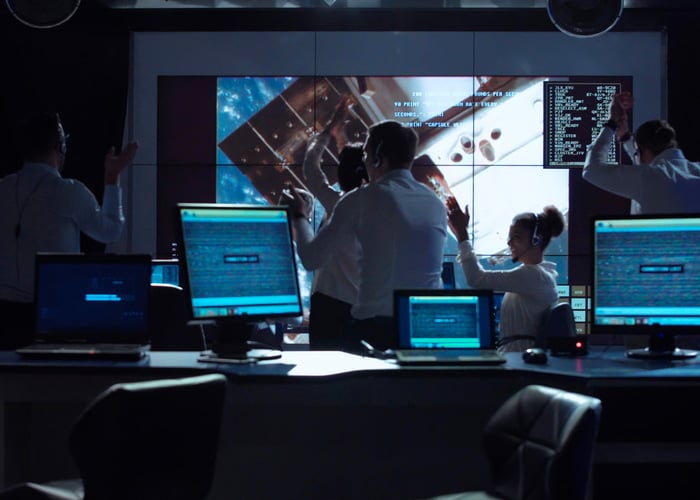 team working in a control room