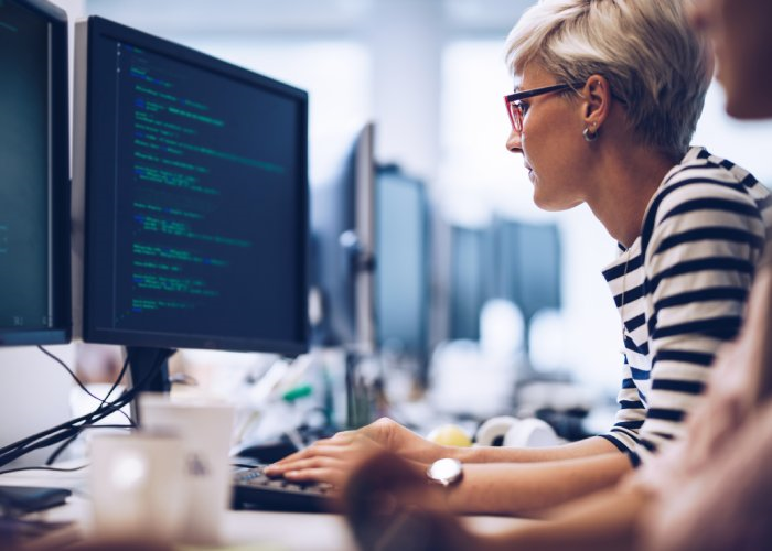 Developer working with multiple monitors