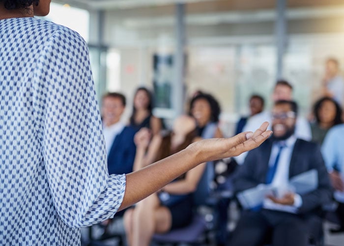 Person speaking to an audience