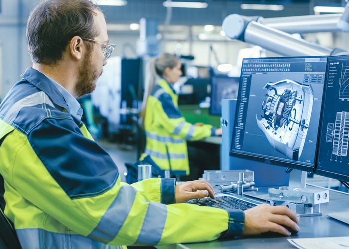Looking at monitor during manufacturing