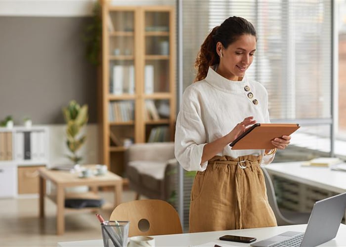 Standing women using Tab