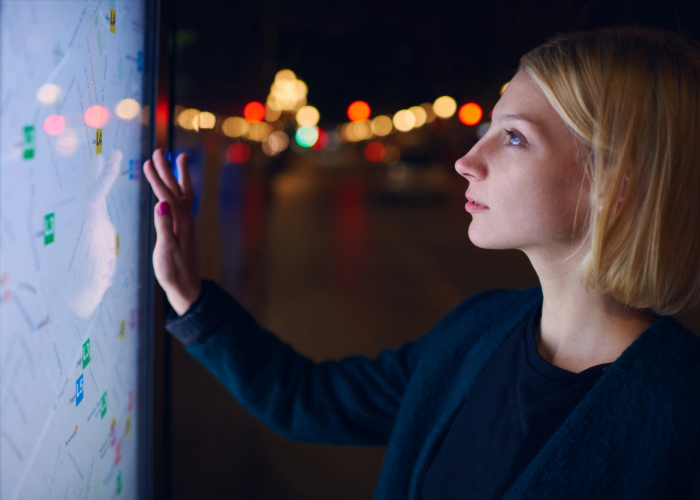 Person interacting with a digital touchscreen