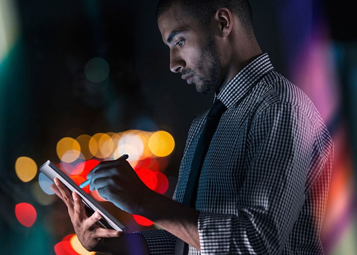 Businessman using his digital tablet