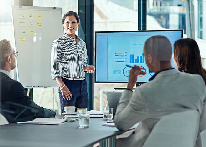 Businesswoman Delivering a presentation in the boardroom