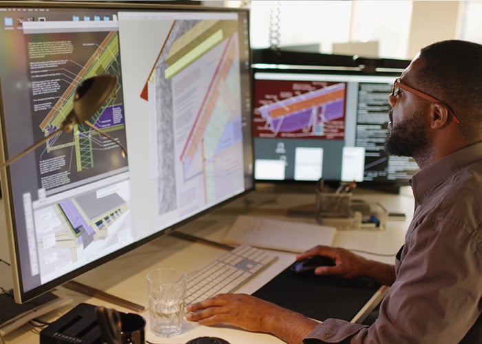 Engineer designing 3D models on CAD software