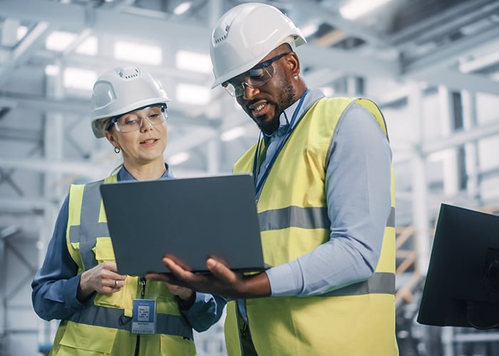 Construction engineers on a laptop