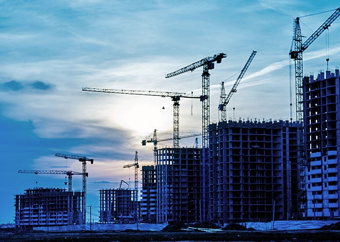 Construction site with a crane at dusk