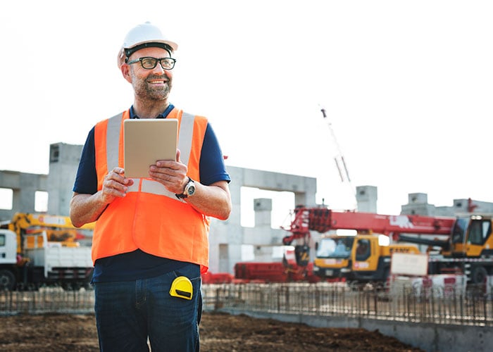 Construction worker planning a project