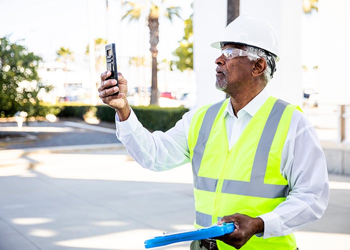 Construction worker surveying