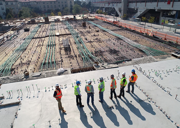 Construction workers on foundation