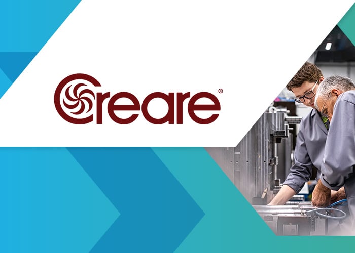 Creare customer story: engineers working on manufacturing equipment