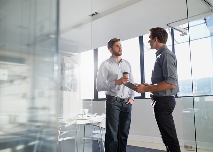 Two business professionals discussing