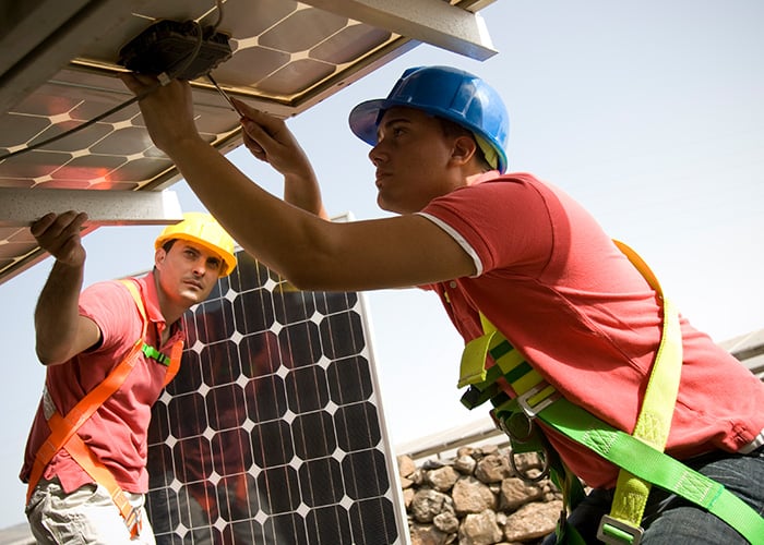 Engineer installing solar panels