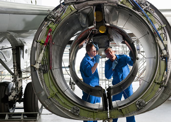 Engineers working on a turbine
