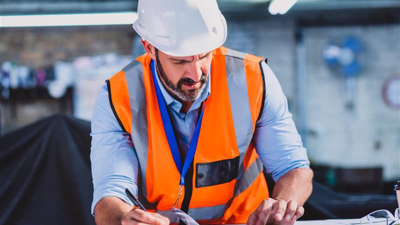 Worker making plans on a tablet device
