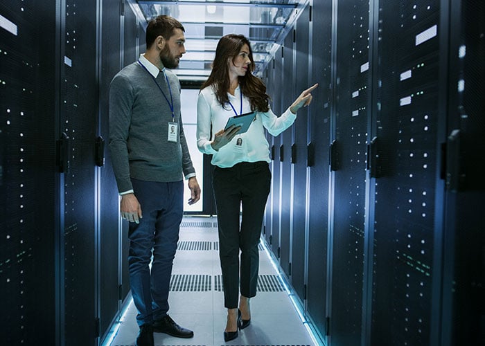 IT Professionals Managing Cloud Infrastructure and Server Operations in Data Center