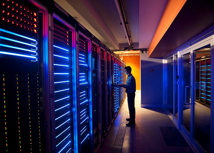 IT engineer configuring servers in data center