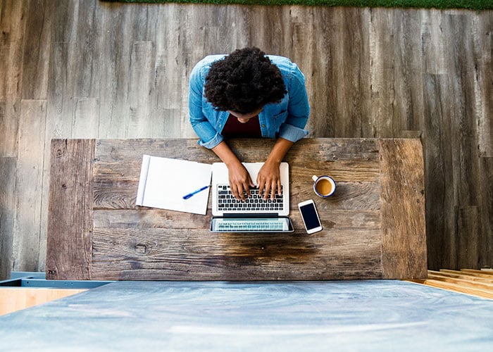 Overhead view of a woman using a computer