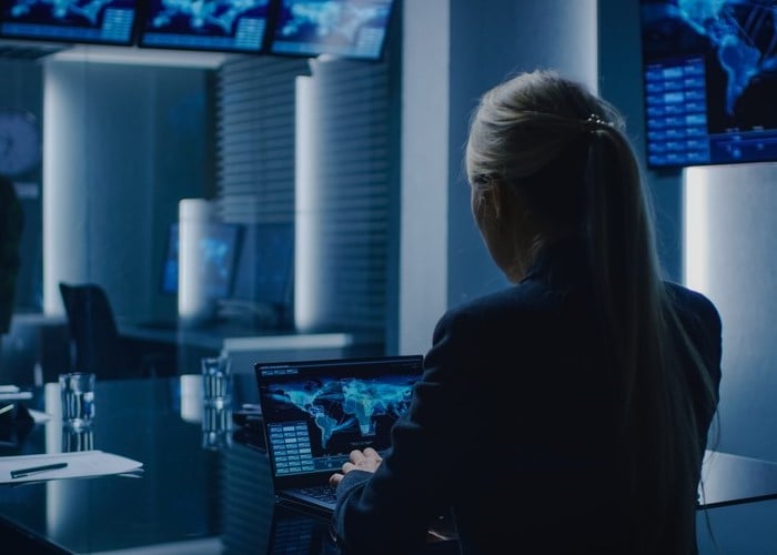 Woman using a laptop in a modern office