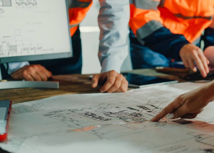 Architect reviewing blueprint